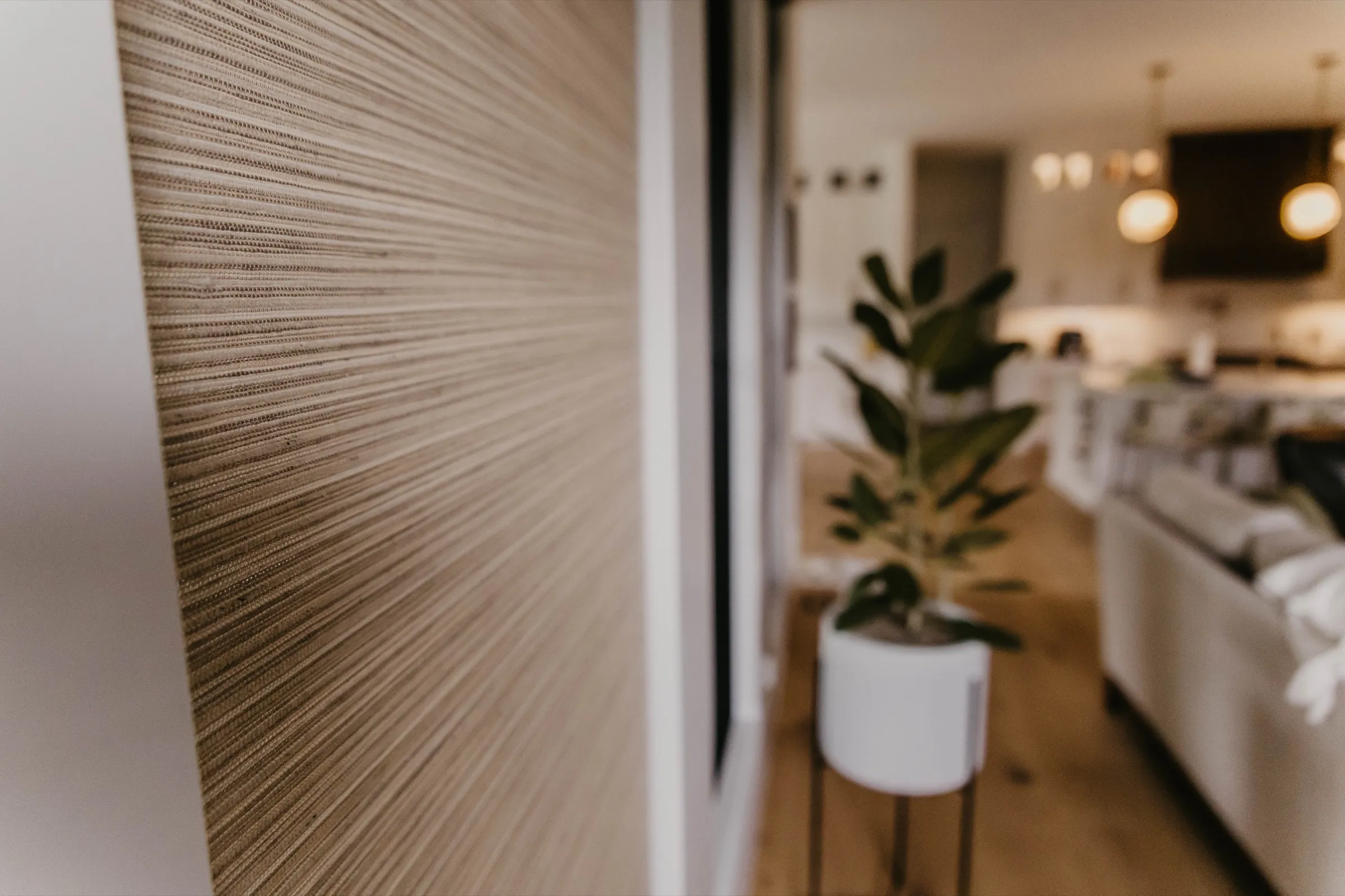 Woven wood shade in a bright, open living space